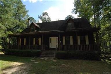 This cedar home surrounded with 15 acres and the s