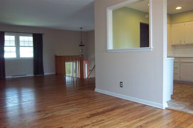View standing in living room to kitchen