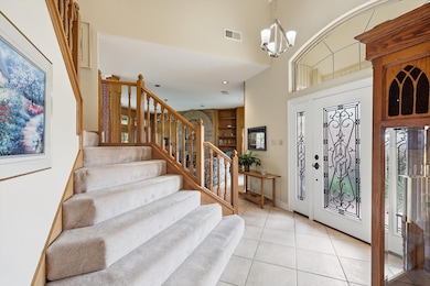 Sightlines from entry draw you in living areas and out to the beautiful back yard