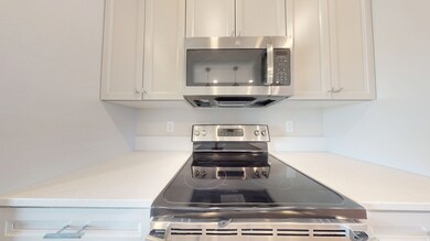 Kitchen featuring appliances with stainless steel finishes