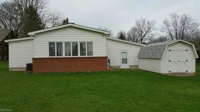 Rear view of house looking west showing the family