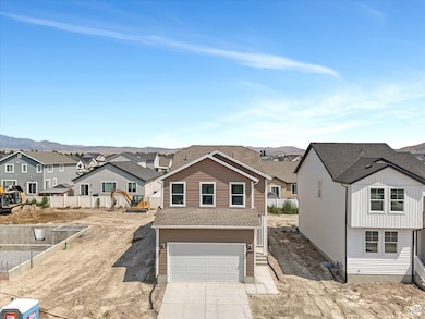 View of front of house featuring a residential view, driveway, an attached garage, and a shingled roof