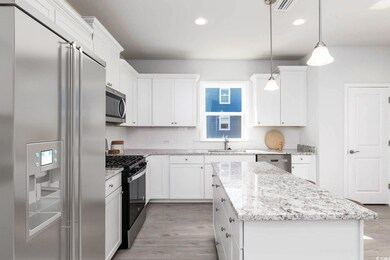 Kitchen with a center island, appliances with stai