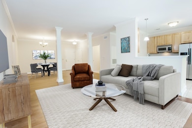 You will love the open floor plan. The Living Room and Dining Room have gorgeous hardwood floors, 9 ft+ ceilings and slider to covered balcony.