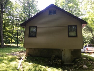 back of house with basement below