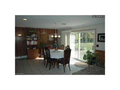 Generous eat in kitchen with large sliding glass door to patio.