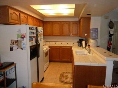 
Delightful Kitchen with lots of wood cabinetry