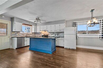 Open kitchen with a large island, add some bar sto