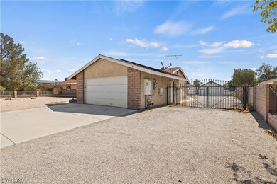 Gated RV parking.  Driveway leads to 20x30 barn wi