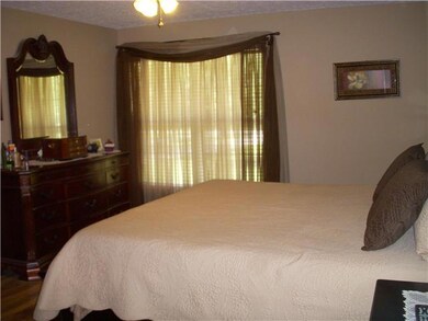 Another view of the large master bedroom with new paint and flooring.
