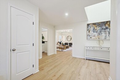 Large entry foyer featuring closet and skylight