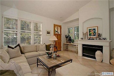 Living room with cozy fireplace - custom plantatio