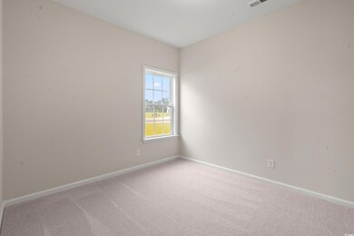 Unfurnished room featuring light carpet and baseboards