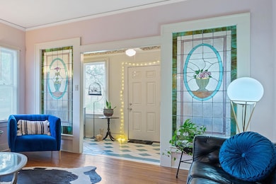 Entryway with crown molding, plenty of natural li