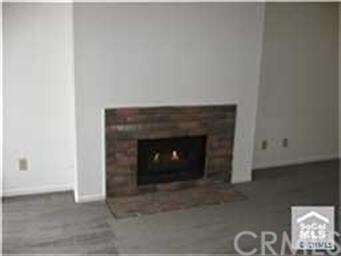 Gas fireplace and logs turns on with a flip of a s