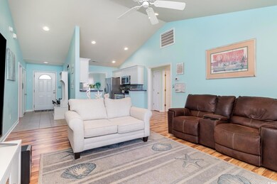 Living area with light wood finished floors, visib