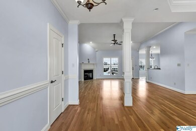 Featuring wood flooring and crown molding.