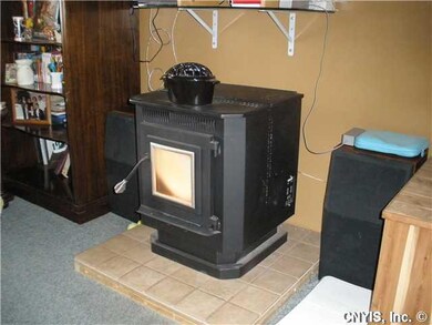 Living Room Pellet stove keeps things nice and toa