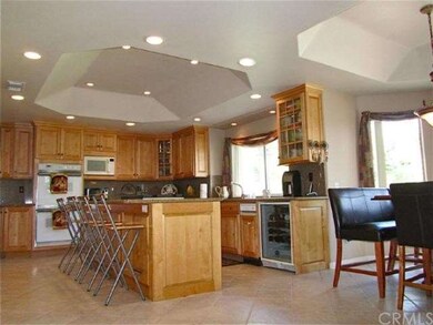 Gourmet kitchen with recessed ceiling, wine refirg