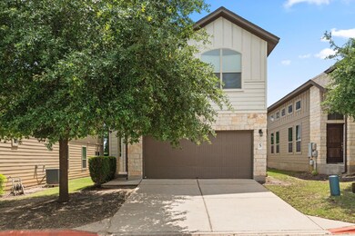 View of front of house featuring stone siding, dr