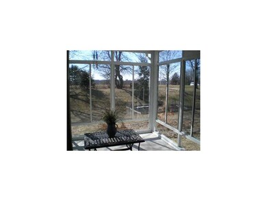 Sun Room. This wonderful three seasons sun room is