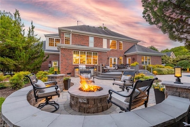 Backyard Oasis with firepit, pool, and outdoor kitchen