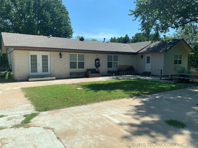 Back of home. Double doors lead to master bedroom.