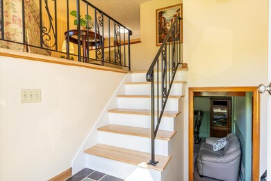 Updated entry way with new hardwood stair treads