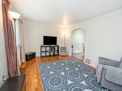 Comfortable and nice sized.  Exposed hardwood flooring.