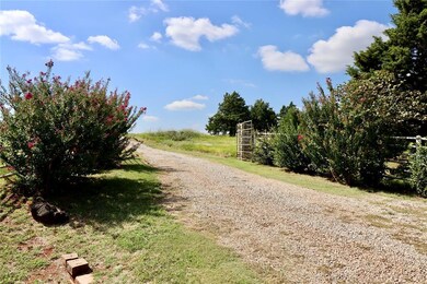 Entry to land, gravel drive and gate