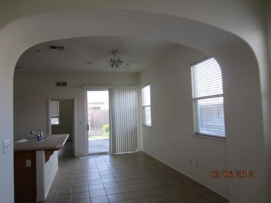 Dining is open to kitchen and has slider to rear y
