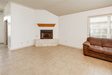 Living area featuring a fireplace with raised hear