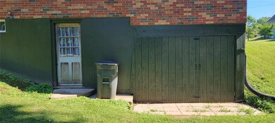 New doors on storage below garage