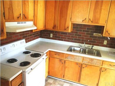 Kitchen has newer stove and sink...