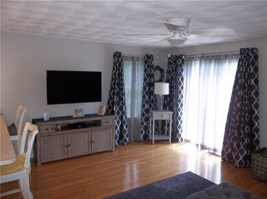 Loads of natural light reflect off of the hardwood