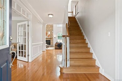 Foyer boasting hardwood floors throughout the firs