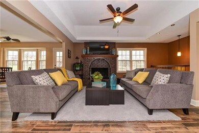 Wonderful Family Room with Iron Spindles to Show O