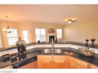 Kitchen. Spacious Kitchen offers an expansive bar top and opens to the Breakfast Nook and Great Room.