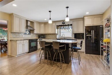 Full view of Kitchen with LVP flooring, recessed l