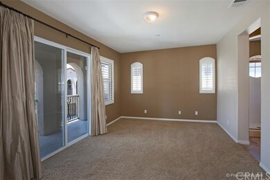 The large master offers sliding doors to the balco