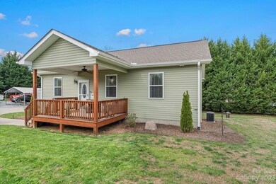 Sitting in the middle of an ample yard, this home has room to enjoy the outdoors and offers plenty of parking.