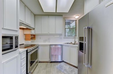 Kitchen featuring appliances with stainless steel