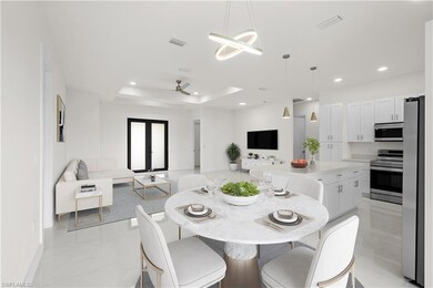 Dining space featuring recessed lighting, a raised ceiling, ceiling fan, and baseboards