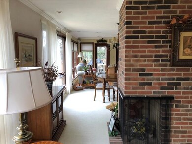 View of Open Dining Room and Sunroom Areas with Be