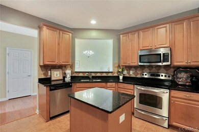 Kitchen with pass-thru to dining area.  Tile floor