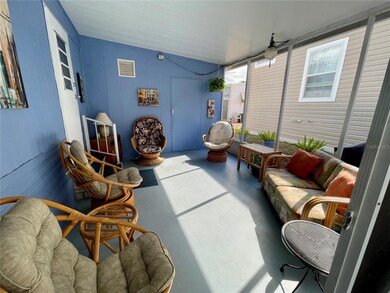 Screen patio, behind the blue door is a over-sized shed where you will find the laundry