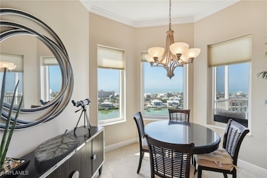 Dining space featuring crown molding, baseboards,