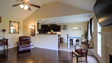 Spacious living room with fireplace! Hardwood floors! Vaulted ceiling! Look at the walkable floorplan here: http://bit.ly/24YFvnU