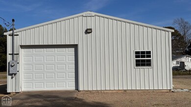 Large Metal Shop, Concrete Slab with Provisions to add Toilet and Air Conditioning.