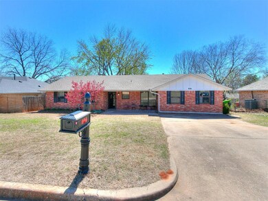 Single story home with a front yard and central AC